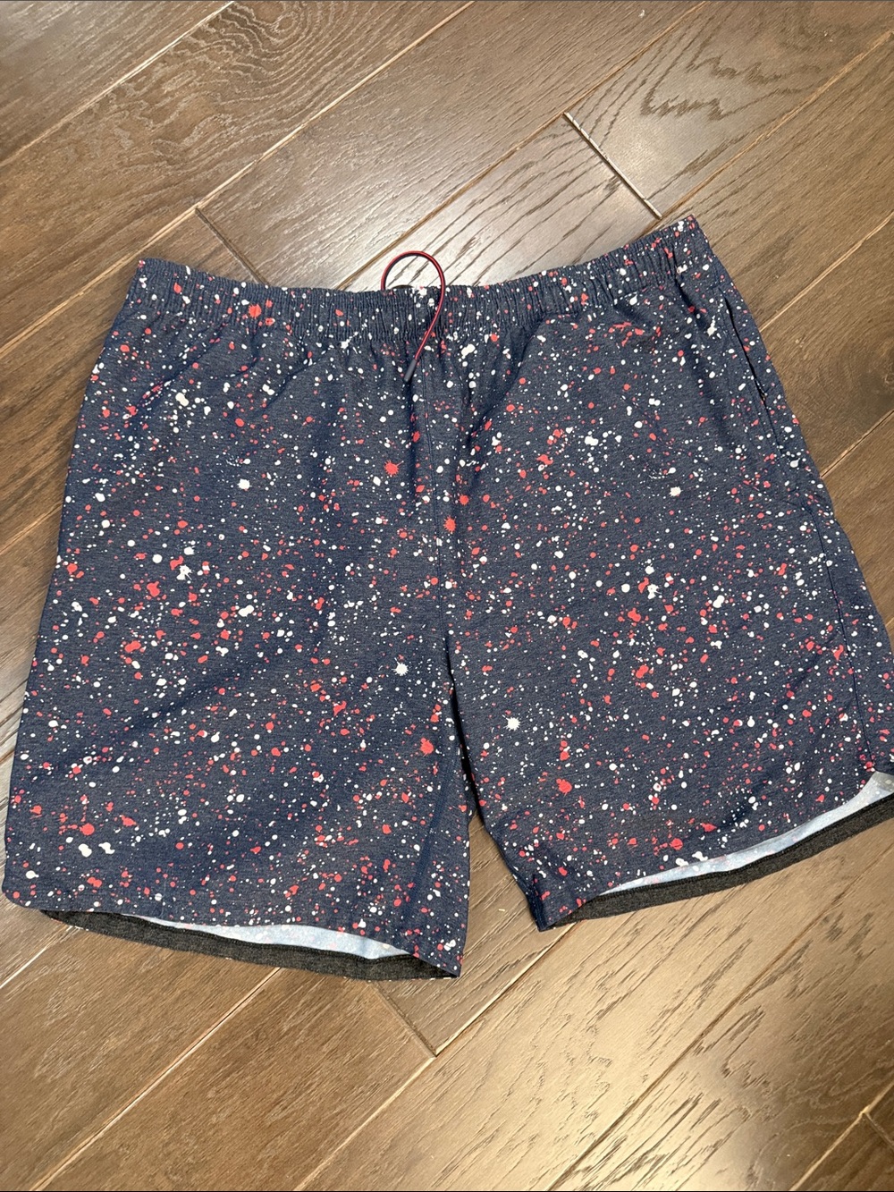 RHONE Navy Swim Trunks with Red & White Splatter